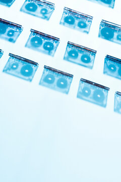 Silhouettes of cassette tapes aligned on blue background