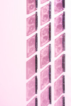 Cassette tapes aligned on pink background