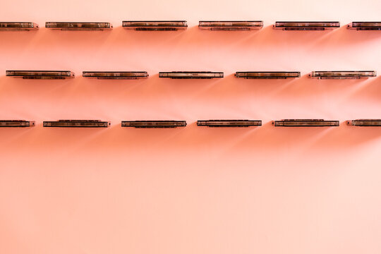 Black cassette tapes aligned in a row