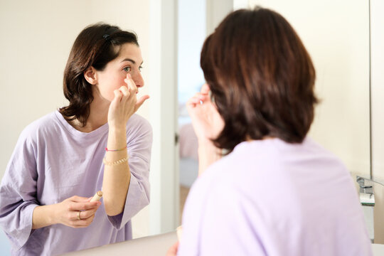 Woman Applying Eye Makeup