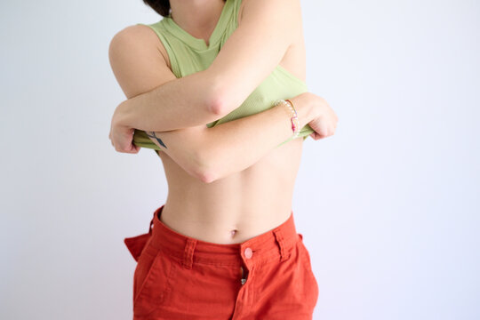 Taking Off Her T-Shirt.