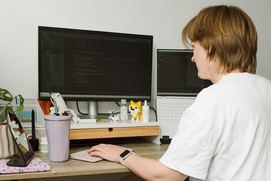 Portrait of a young female programmer on her workplace 