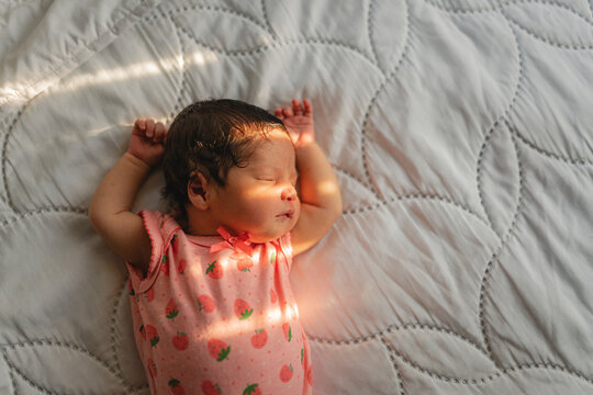 Newborn baby sleeping alone.