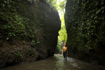 Young white woman at waterfall