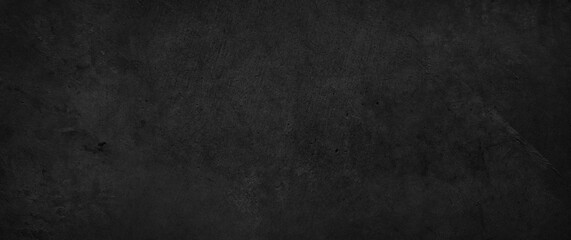 Dark grey black textured concrete wall background