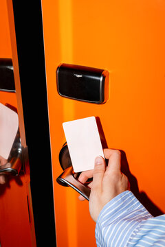 Keycard Entry on Bright Orange Door on Hotel
