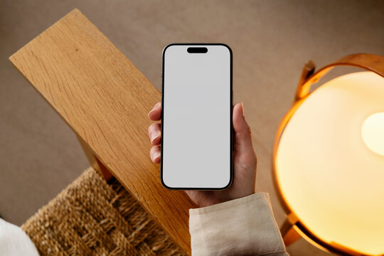 Mockup Smartphone with white screen in cozy home