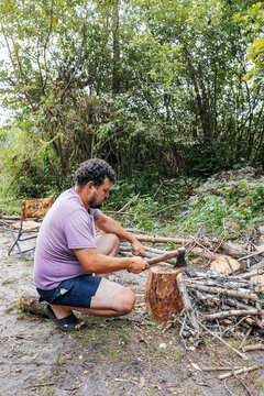 Man Chopping Wood in Forest