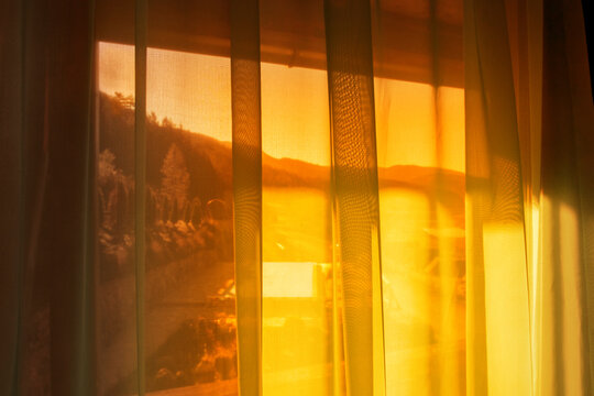 Window curtain in sunlight