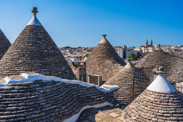Conical roofs of the famous old dry stone trulli houses in Alberobello, Italy