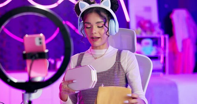 Girl, influencer and tripod for fashion vlog, live stream or social media, connection or audience for online. Female person, gen z and bags for video, content creation and tech in home for mobile app