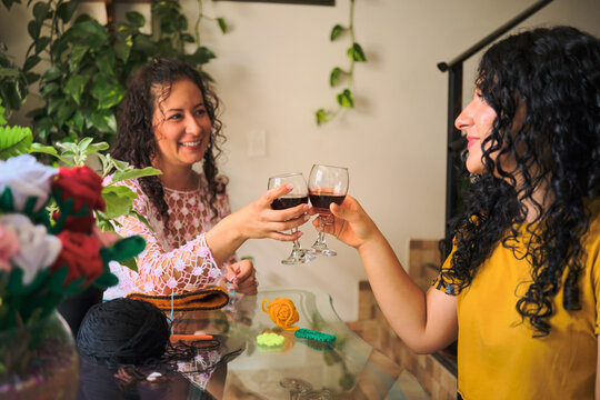 Mother and daughter making a toast
