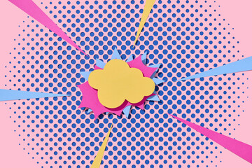 Handmade pink paper cut out dot background with speech bubble.