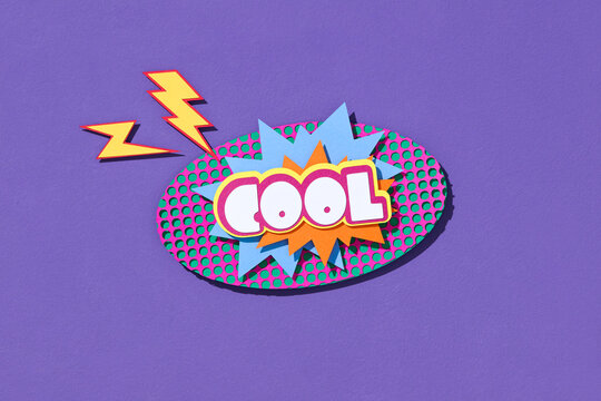 Handmade colorful paper cutting speech bubble with text COOL