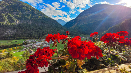 A picturesque look on top of the Alpine Mountain Valley Lechtal and a city Steeg in Austria on a...