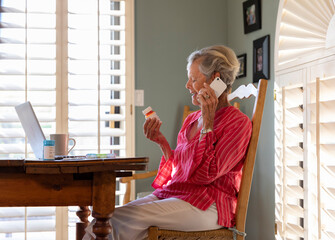 Senior  ordering refill on mobile phone 