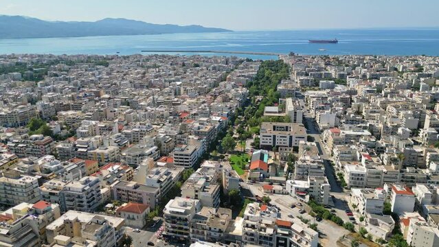 An aerial photograph showcasing Kalamata, Greece, with its charming city center and picturesque coastline.