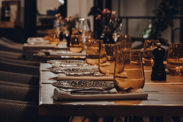 Set tables inside a restaurant, shallow focus.