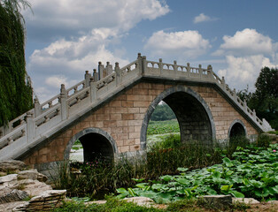 Fototapeta premium Beautiful bridge built in traditional Chinese architectural style, within the Summer Palace complex in Beijing, China