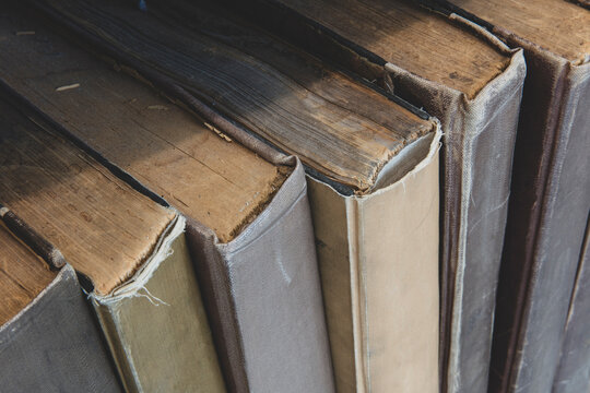 Close up of old books on shelf