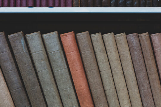 Row of old books on shelf