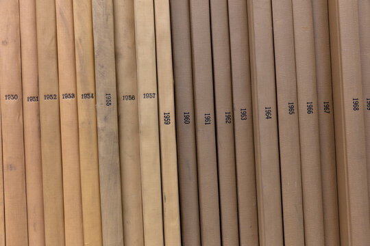 Close up of old periodicals on shelf