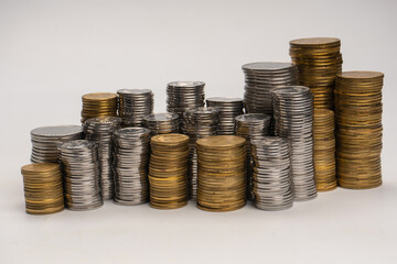 Pile of coins isolated on a white background.