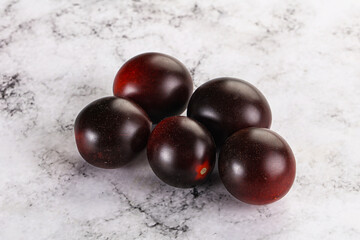 Raw ripe black kumato tomato