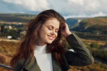 Serene young woman with closed eyes enjoying a sunny day in the majestic mountains portrait beauty, nature, relaxation, travel, peacefulness