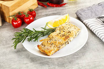 Baked salmon fish served rosemary