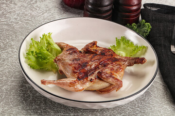 Grilled quail in the plate