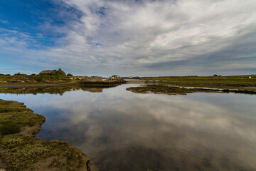 pebble beach pond and sea, blue sky.