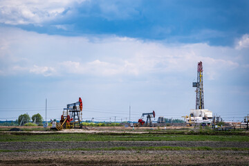 Oil production in oilfield. Petroleum industry, oil crisis.
