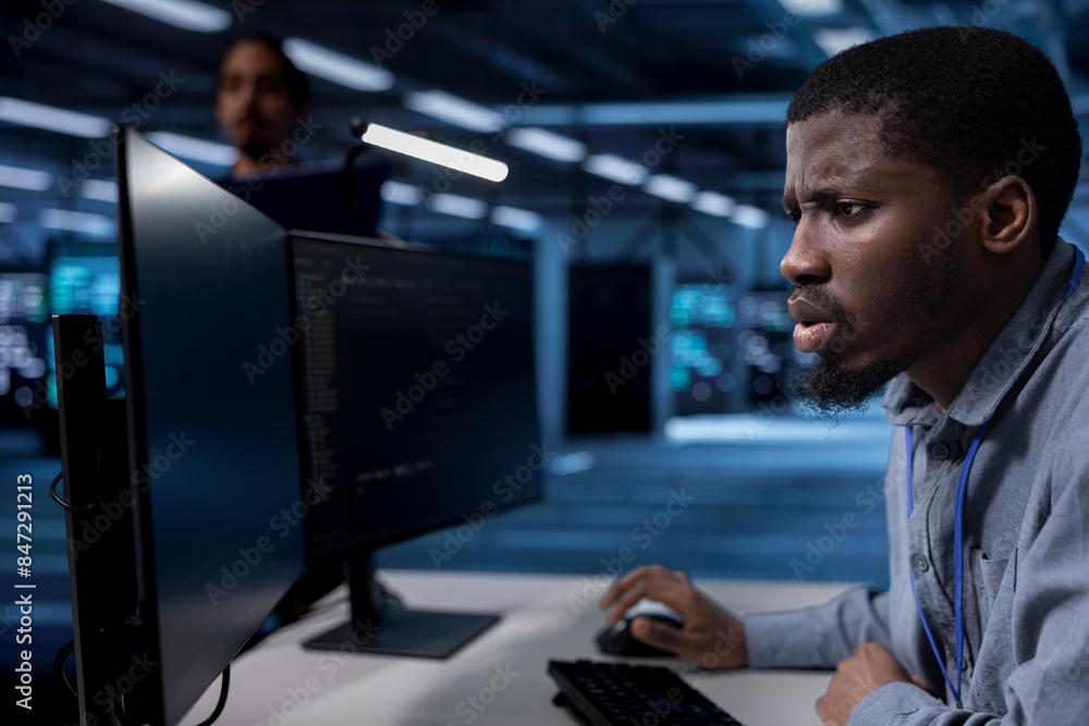 Poster admin frowning after seeing error in server farm while overseeing supercomputers used for managing d