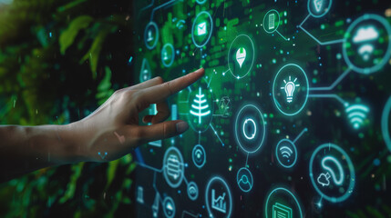 A hand pointing at a green screen with a lot of icons and a tree - Powered by Adobe