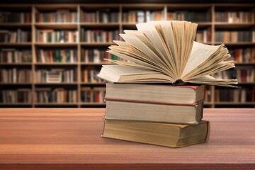 Book stack on the desk in public library