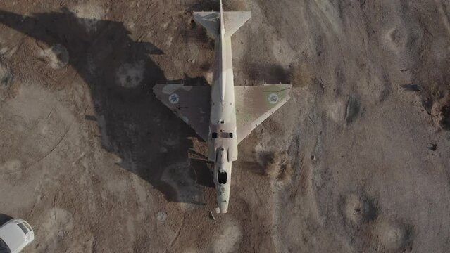 Aerial video of an abandoned fighter plane in the desert, Israel