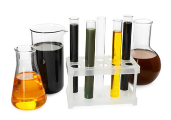 Beaker, test tubes and flasks with different types of oil isolated on white
