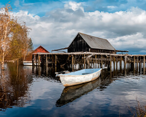skiff floating peacefully, undisturbed