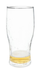 Almost empty glass of beer isolated on white