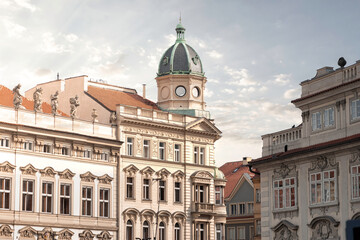 Elegant classical buildings are standing on a square in the city center of Prague, Czech Republic