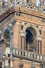 Detailed View of Giralda Bell Tower with Latin Inscriptions in Seville, Spain