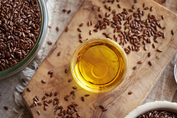 Flax seed oil in a glass bowl, top view