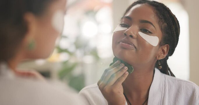 Women, gua sha and together for face, skin or massage with jade stone for circulation, health and benefits in home. Girl, people and friends with tools for cosmetics, eye mask or dermatology in house