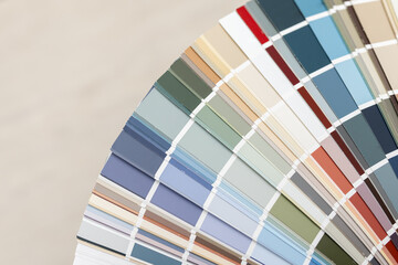 A fan of paint swatches showcasing a wide range of colors.

