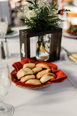 Table centerpiece with number 4, floral arrangement, and bread basket

