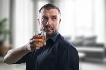 Health care alcoholism concept, young man holding glass