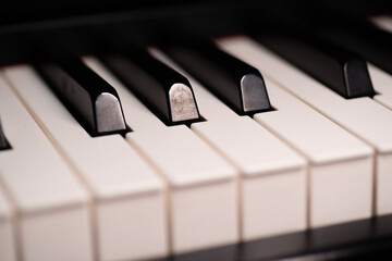 Jazz Piano Keys. Close-up of piano keys, focused on one note, with foreground and background fading...