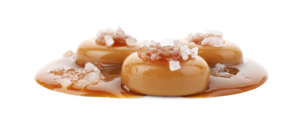 Yummy candies with caramel sauce and sea salt isolated on white