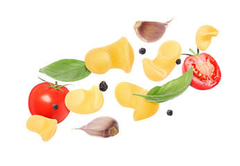 Raw pasta, tomatoes, garlic and basil in air on white background